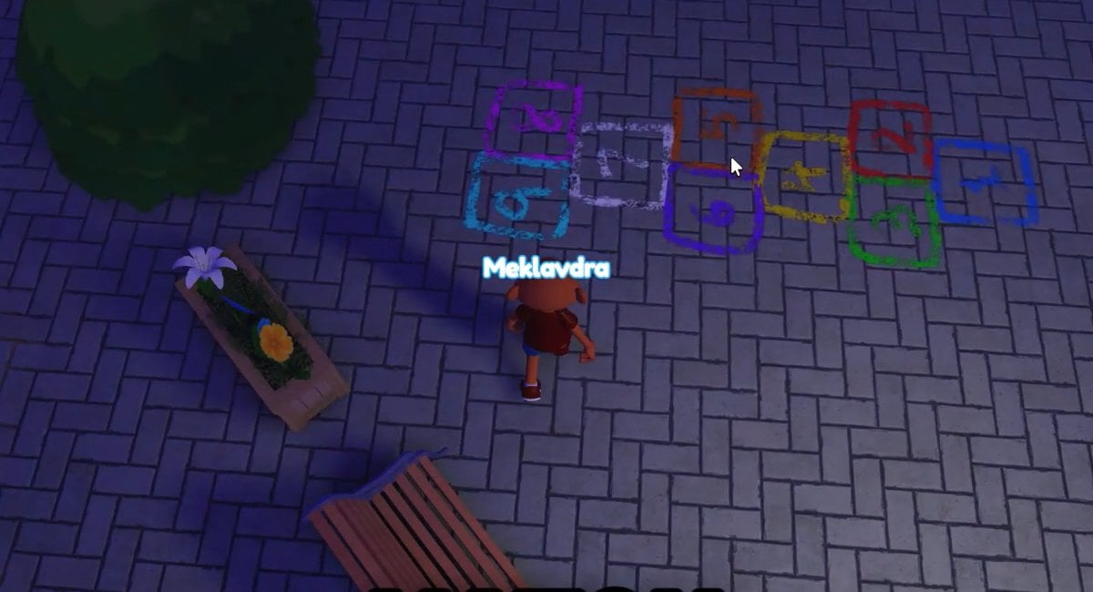 Hovedpersonen ser på Hopscotch -kunsten på plazaen i Threadville.
