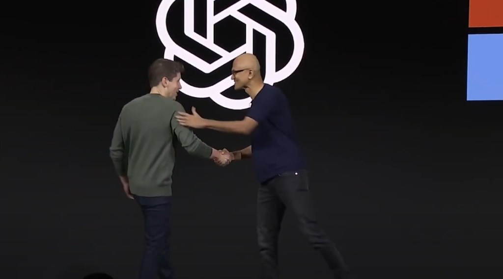 openai ceo sam altman shaking hands with microsoft ceo satya nadella